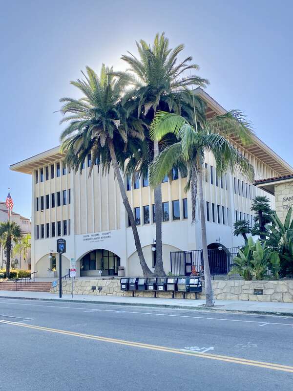 Built in 1965-1966, this Modern New Formalist-style building was constructed to serve as an office building for Santa Barbara County, supplementing the old Santa Barbara County Courthouse.  The building features a Miesian curtain wall with