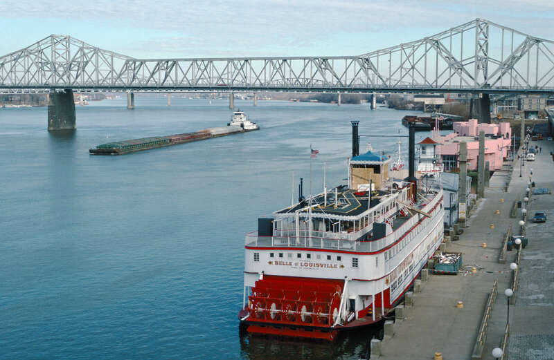 Steamboat &quot;Belle of Louisville&quot; at wharf, with Clark Bridge in distance 
Louisville, Kentucky, USA 

Ohio River mile 604