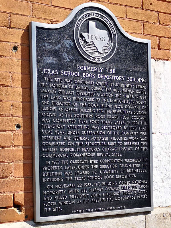 The photograph shows the Texas Historical Commission Plaque affixed to the Former School Book Depository Building in Dallas, Texas.
The full text on the plaque as photographed reads:
Formerly The Texas School Book Depository Building
This site was