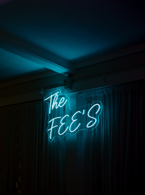 The Fee’s Wedding Neon Sign – A 36-inch (W) x 20-inch (H) ice blue neon sign displayed at Logan &amp; Benny’s wedding in Michigan, USA.