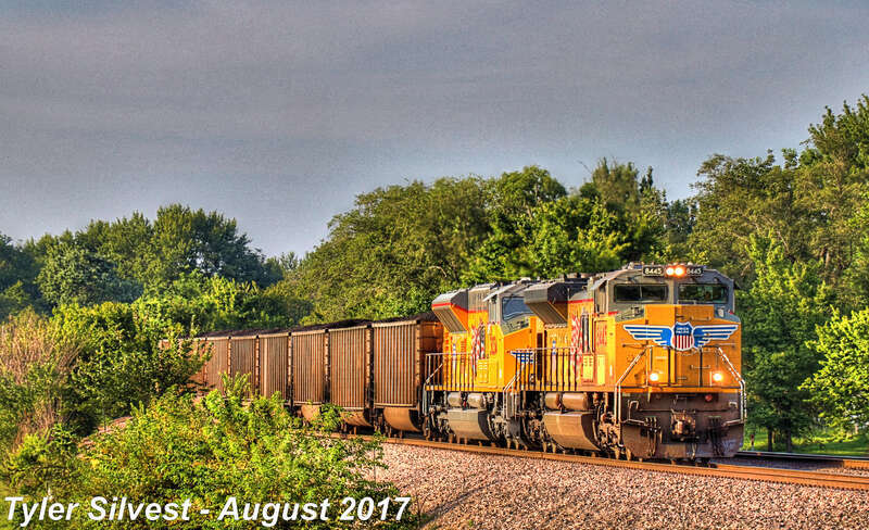 Union Pacific 8445(SD70ACe), 3034(SD70AH-T4) and 7143(AC44CW) Lead a Southbound Coal Drag on the BNSF Fort Scott Sub stopped and waiting at CP 215 for a connector train to clear near Dennis Avenue Crossing east of Keeler Street in Olathe, KS.
Train: