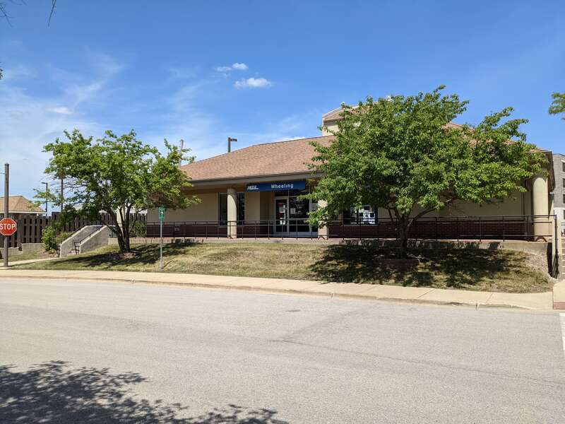 Wheeling Metra Station taken from the parking lot on 2021-06-05.