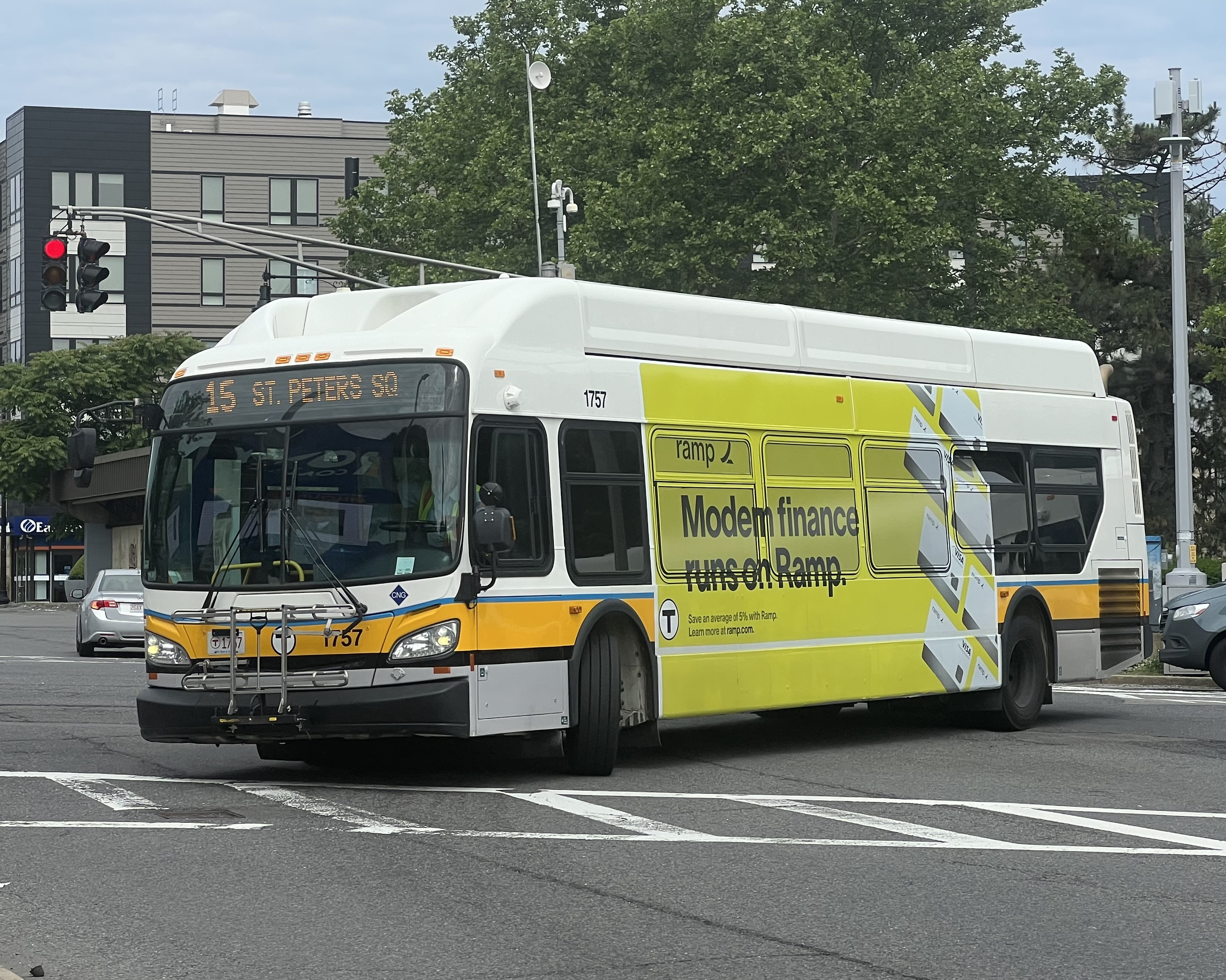 MBTA route 15 bus turning onto Malcolm X Boulevard at Roxbury Crossing in June 2024