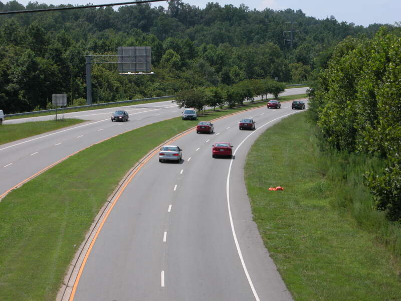 A City of Chapel Hill, North Carolina police cruiser laying a speed trap on US 15-501.  The trees in the median give him effective cover from the motorists facing the camera.