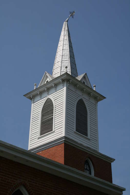 Steeple of St Paul African Methodist Episcopal (AME) Church with a bent spire in Chapel Hill, North Carolina.