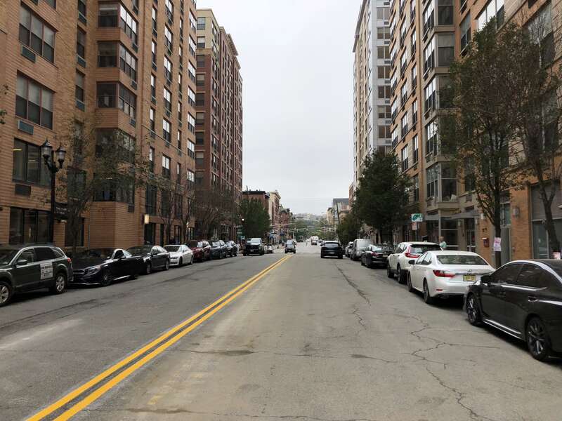 View west along Hudson County Route 670 (14th Street) between Frank Sinatra Drive and Bernard McFeeley Shipyard Lane in Hoboken, Hudson County, New Jersey