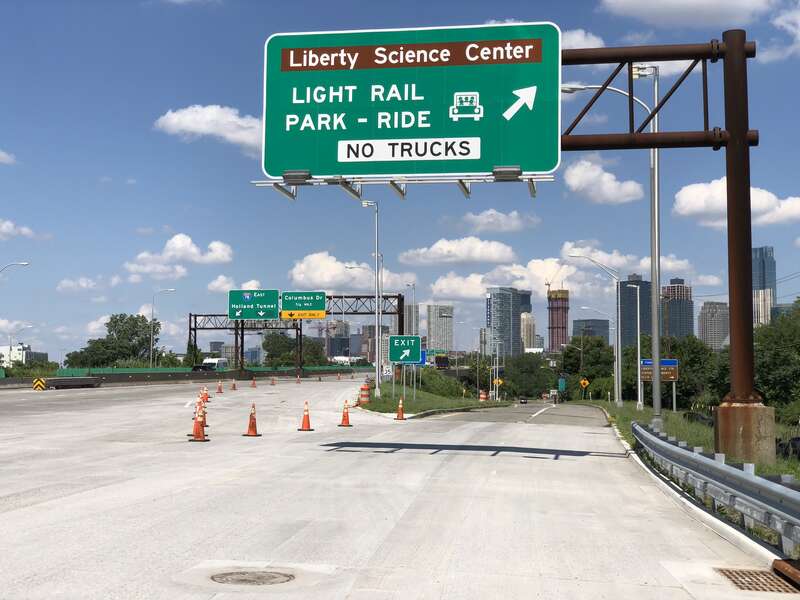 View east along Interstate 78 (New Jersey Turnpike Newark Bay Extension) at the exit for the Liberty Science Center (Light Rain, Park-Ride) in Jersey City, Hudson County, New Jersey