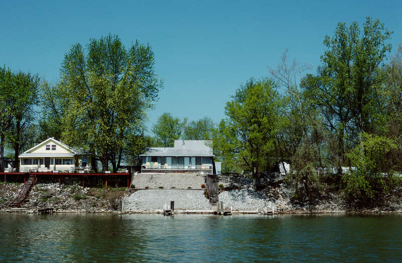 Looking ~WNW from Ohio River toward Indiana bank.
Photo 8 of 25-photo series of Ohio River mile 596 (right descending bank), taken from boat moving upstream (left to right).
.
Houses on South Front Street, Utica, Indiana.
.
Ohio River mile 596 (right