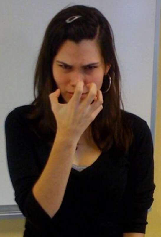 The final posture of the ASL sign ANGRY (wikt:en:Claw5@NearNose-PalmBack)