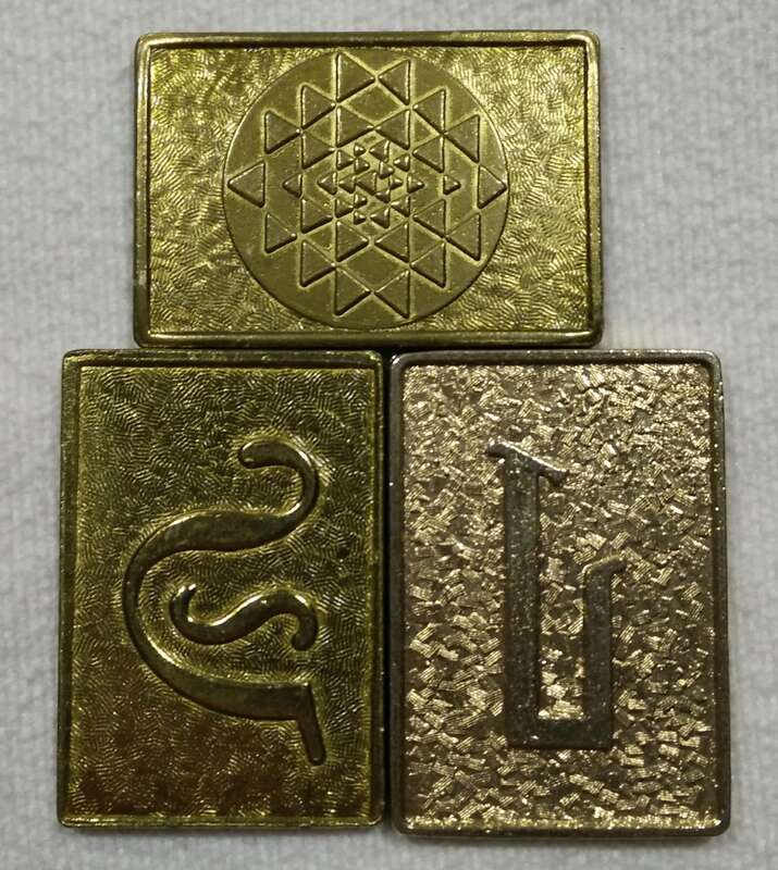 Battlestar Galactica Cubit Prop. Set of 3. Battlestar Galactica (1978 TV series). Showing stylized Initial &quot;G&quot; (left), stylized Initial &quot;L&quot; (right), Reverse side pyramid grid design (top).