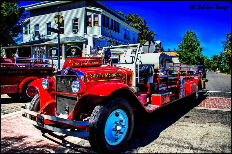 The front end of a fire truck from 1931 from South Meriden Volunteer Fire Department. The crew spent many years to get this beautiful truck back to it's original condition. It looks superb. and, very RED. The photo was taken on September 14, 2014, on