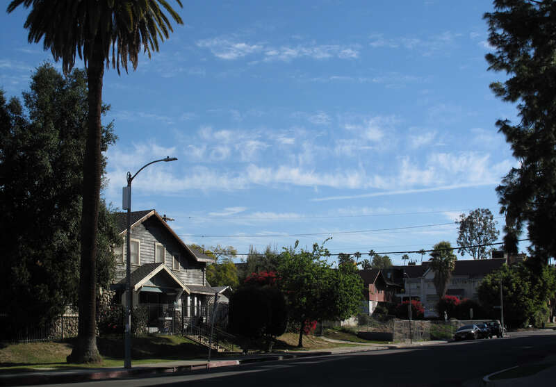 House at 354 S. Harvard Blvd, Los Angeles, with cirrus fibratus clouds