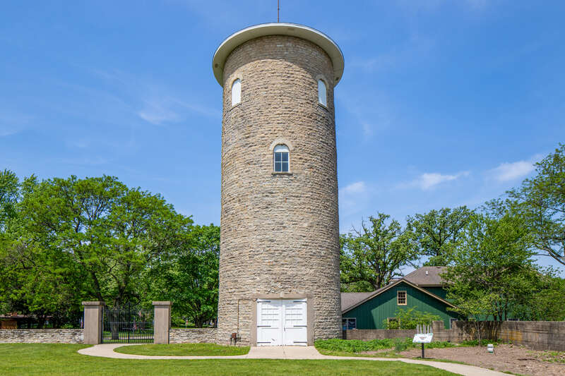 Water tower, Ellwood House, DeKalb, Illinois. &quot;On the west (rear) of the Ellwood House, the circular limestone water tower is about 50 feet (15.2 m) tall and has a diameter of 18 feet (5.5 m). The tower has windows occurring at different levels,