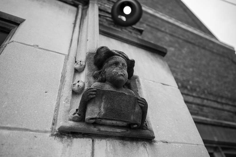 An eroded student architectural sculpture adorning the entrance portal archway of Public School No. 1 in Troy, New York.