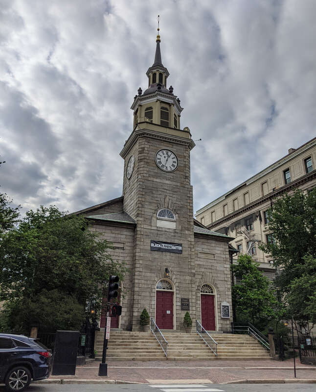 Photograph of the First Parish Church on Congress Street at the head of Temple Street in Portland, Maine, USA, viewed from Southwest corner of Temple and Congress Streets. Photo taken with a Google Pixel phone on June 27, 2020.