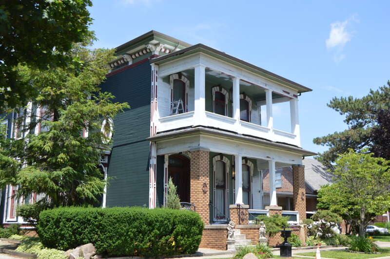 Front and western side of the George and Helen Tate House, located at 114 E. Jefferson Street in Kokomo, Indiana, United States.  Built in 1878, it is listed on the National Register of Historic Places.