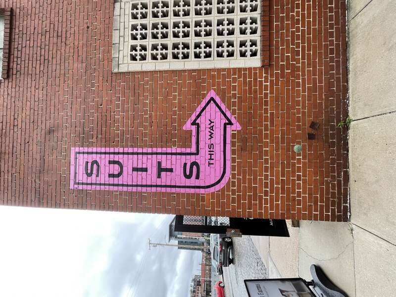 USCGS disk embedded in the side of the H. G. Dreyer &amp;amp; Co. Packing Box building in Harbor East
