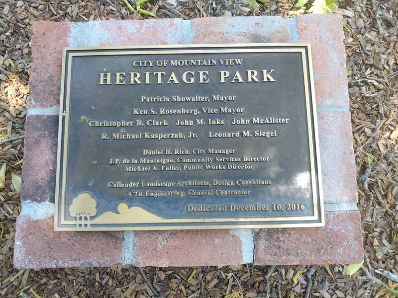A historical plaque marking the dedication date of Heritage Park as &quot;December 10, 2016&quot;.