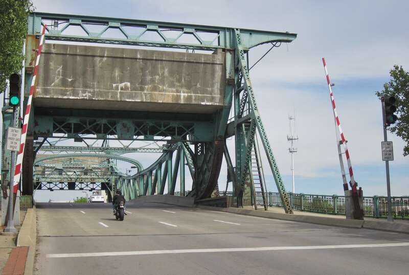 Looking onto the Jefferson Street Bridge, in Joliet, Illinois, from its west end. It is one of four Scherzer Rolling Lift bascule bridges in Joliet, all of which span the Des Plaines River. The Jefferson Street Bridge carries eastbound US Route 30.