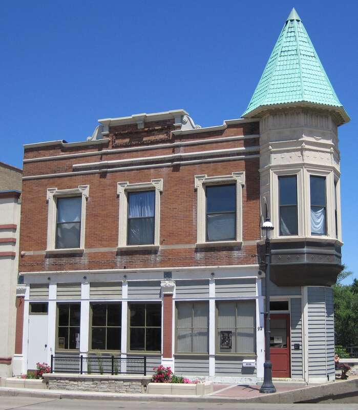 Lyman Andrews Block in the Dundee Township Historic District in West Dundee (c. 1895). The Dundee Post Office occupied the east (right) side of the building and the Keegan Barbershop was in the west side.