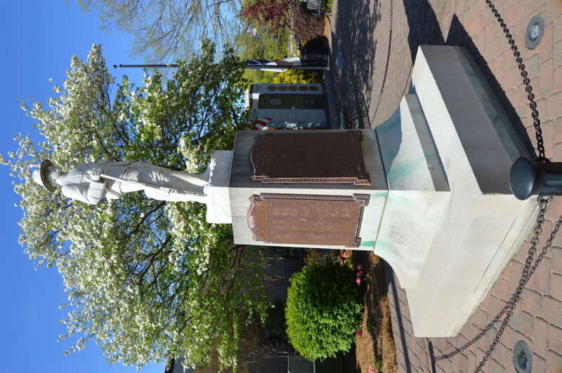 Southwestern-angle view of the High Point First World War memorial, located at the Main Street overpass over the rail line in downtown High Point, North Carolina, United States.  No date is present, but the plaques' references to &quot;The World War&quot;