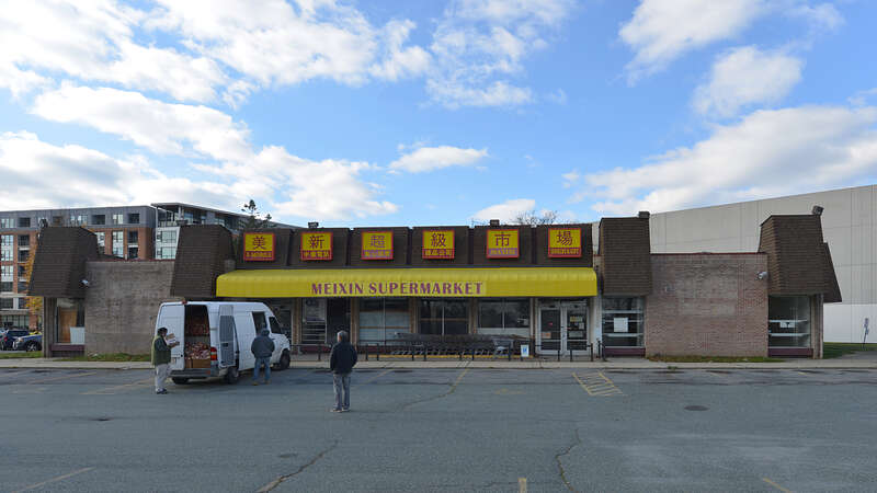 Meixin Supermarket, an Asian food store that closed in 2019. The building was designed in 1968. 460 Hungerford Drive, Rockville, Maryland 20850.