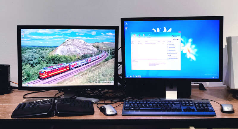 Microsoft Windows Multipoint Server 2012 displaying two concurrent desktop sessions (controlled by two separate sets of keyboards and mice) on two separate monitors.