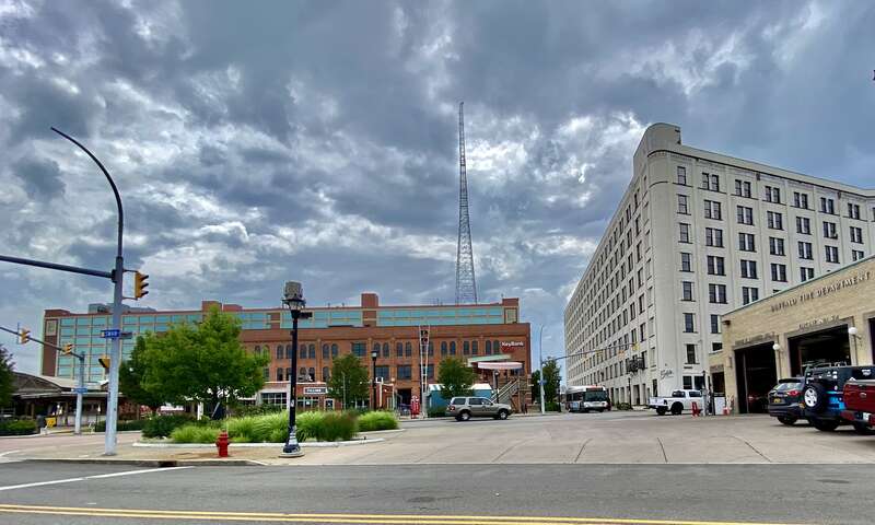 As seen in August 2022, a northbound NFTA Metro Bus on route #18 waits at a traffic light at the corner of Seneca and Van Rensselaer Streets in the Larkinville district of Buffalo, New York. The bus will arrive about 20 minutes later at its terminus,