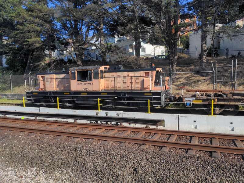 BART maintenance locomotive #5013 made by Plymouth on a siding north of Daly City station on April 2022