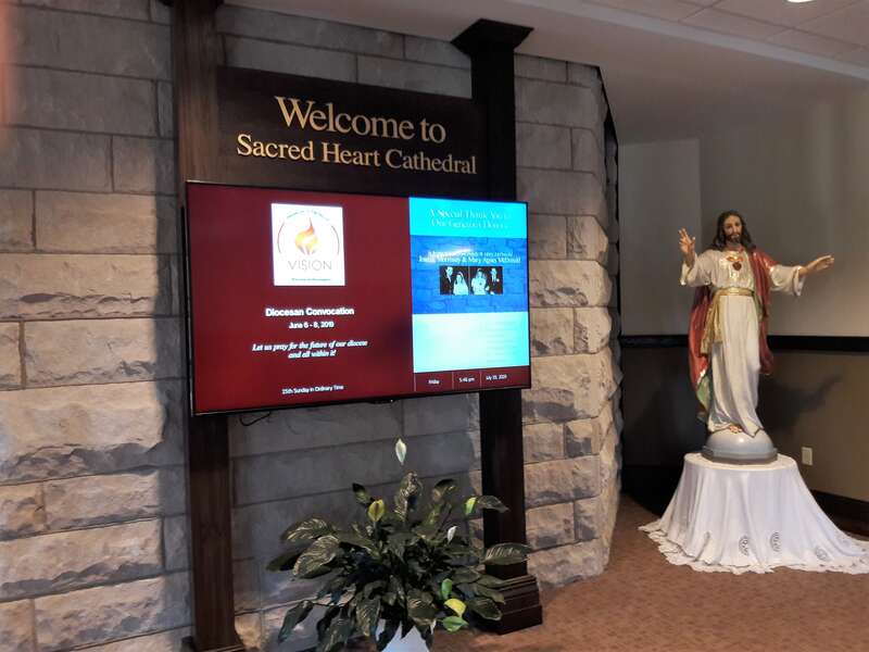 The video message board in Sears Center Diocesan Hall at Sacred Heart Cathedral, Davenport, Iowa.
