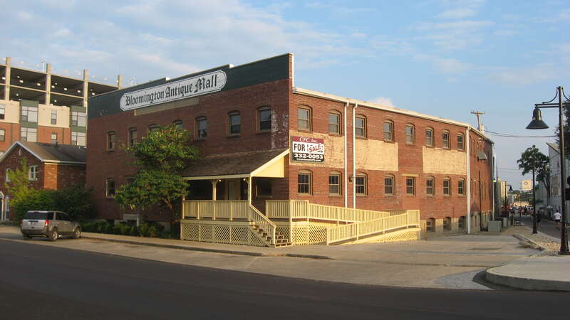 Front and western side of the former Bloomington Wholesale Grocery Company building — now an antiques mall — located at 311 W. Seventh Street in Bloomington, Indiana, United States.  Built in 1913, it is part of the Bloomington West Side Historic