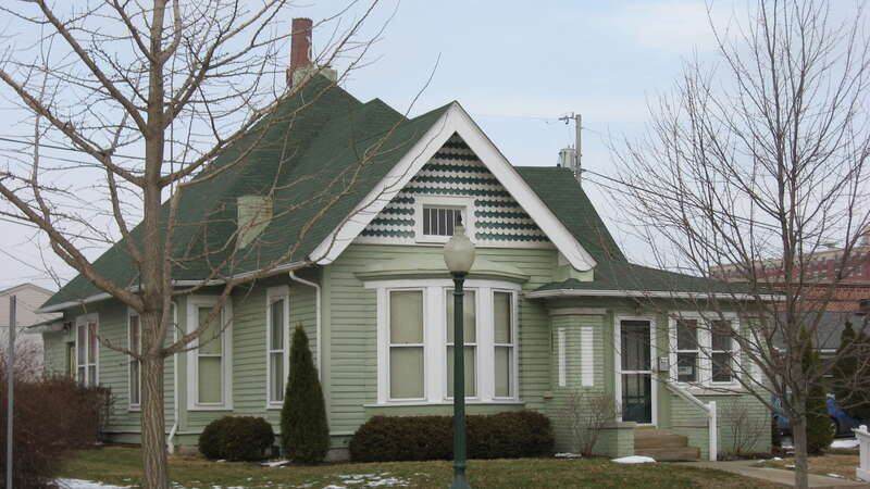 Front and western side of the Jesse Howe House, located at 414 W. Sixth Street in Bloomington, Indiana, United States.  Built in 1905, it is a part of the Bloomington West Side Historic District, a historic district that is listed on the National