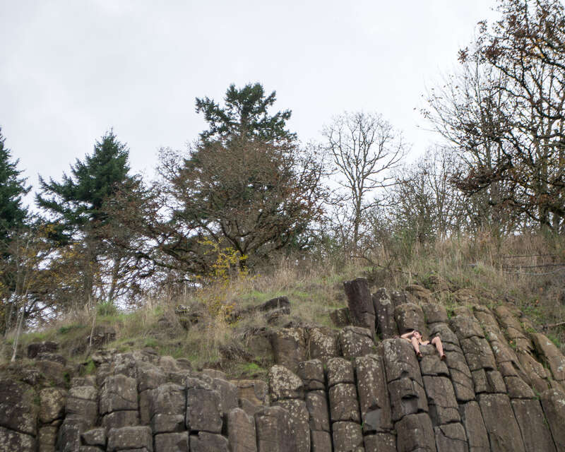 A climber relaxes at the top of the Skinner Butte Climbing Columns after scaling No. 34, the Outer Column No Jam