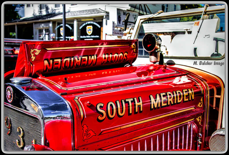 The front end of a fire truck from 1931 from South Meriden Volunteer Fire Department. The crew spent many years to get this beautiful truck back to it's original condition. It looks superb. and, very RED. The photo was taken on September 14, 2014, on