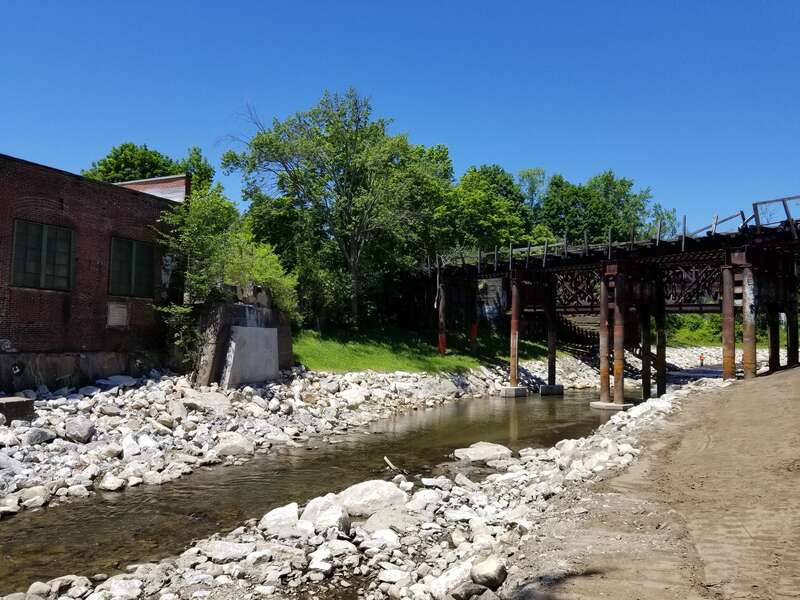 &quot;Tel-Electric site post-dam removal June 2020. The West Branch of the Housatonic River flows freely past the historic Tel-Electric factory building and a small portion of the former dam.&quot;