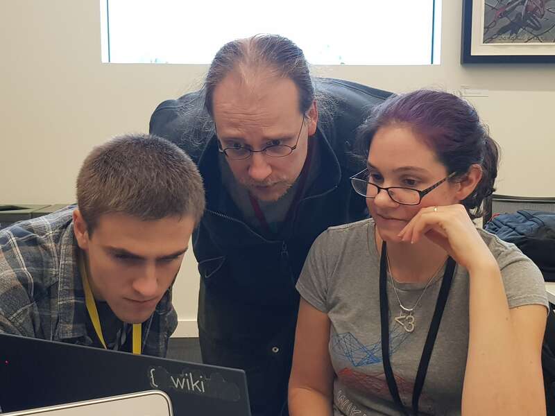 Thomas Arrow, Daniel Mietchen and Marielle Volz working on the do-a-thon day of WikiCite 2018