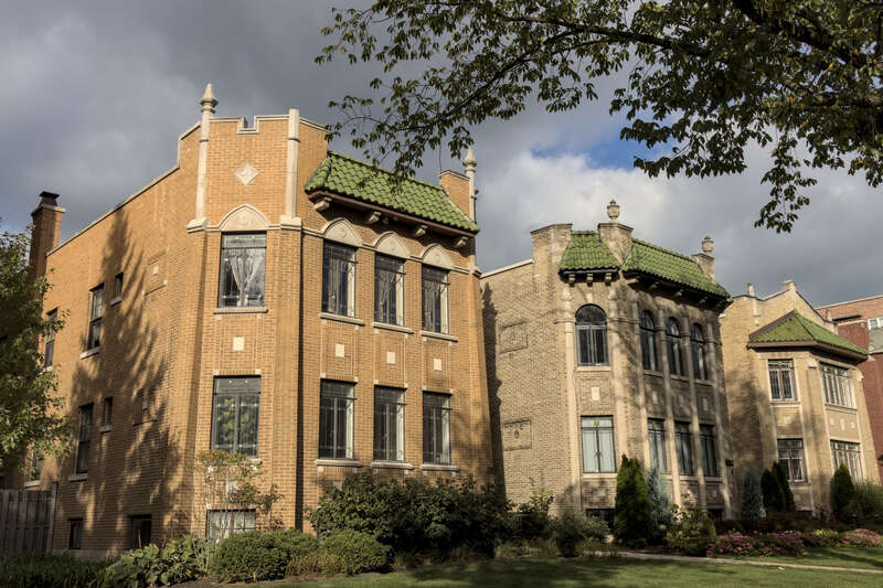 Three houses on the National Registry of Historic Places in Evanston, Il, during afternoon in autumn.