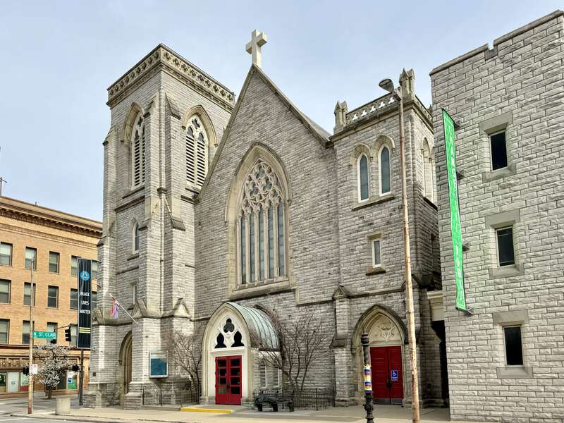Built in 1863-1866, this Gothic Revival-style church was designed by C. C. Miller for the congregation of Trinity Episcopal Church, established in 1842.  The church saw the addition of a Gothic Revival-style parish house in 1875, which wraps around