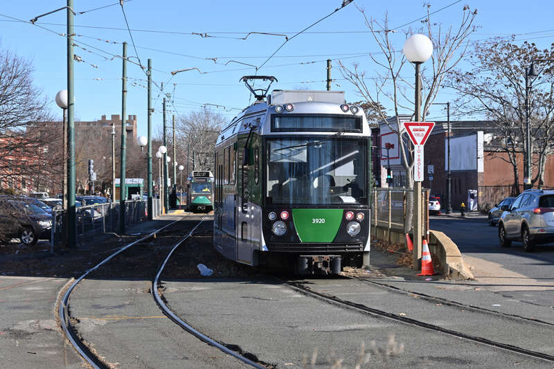 A Type 9 train and a Type 8 train (left, in the background) at Cleveland Circle station