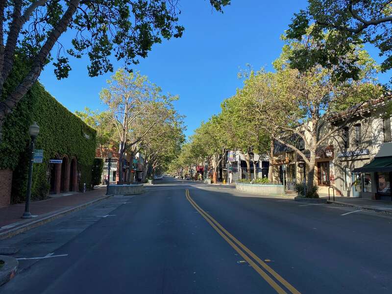A deserted University Avenue at Waverley Street in downtown Palo Alto, California, on April 24, 2020.