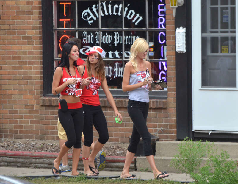 Several Badger fans, I guess, heading up Regent Street toward Camp Randall in Madison, Wisconsin on a football game day