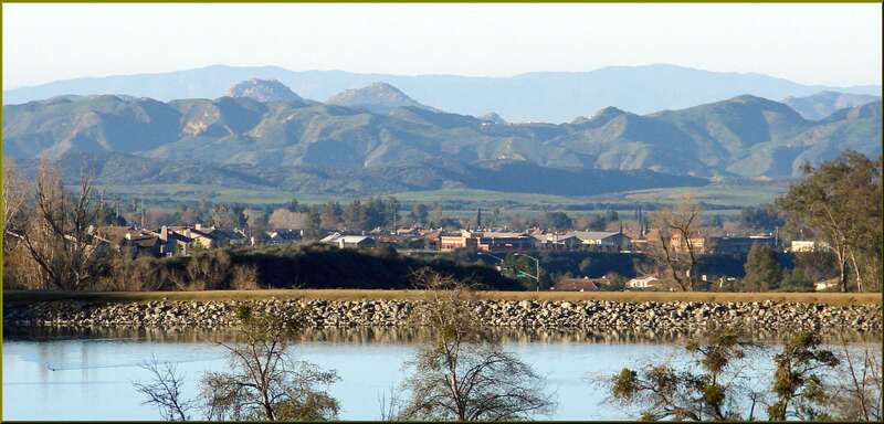 (1 in a multiple picture set)
Looking south across a portion of Yucaipa with the lake at the park in the foreground and the hills in the distance.