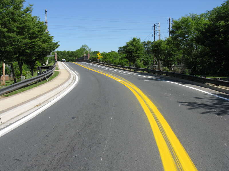 MD 564 at Chestnut Avenue (former MD 197), Bowie, Maryland.  The markings along the bridge were removed (by grinding) the previous day.  New markings were applied earlier in the morning.  The final configuration shifted westbound traffic (away from