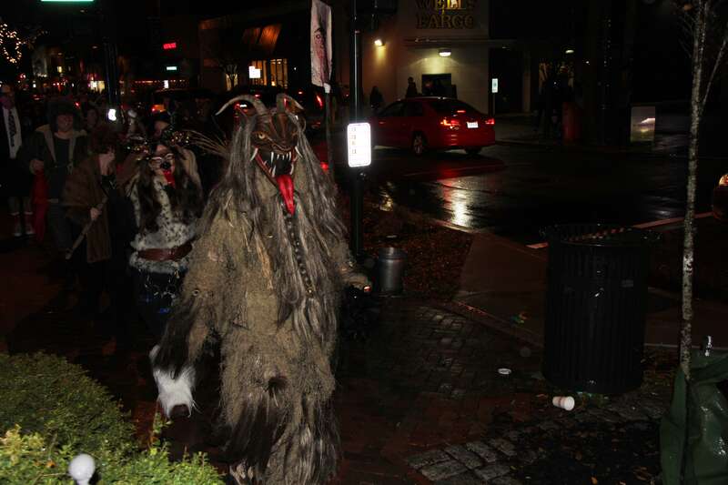 St Nicholas leading the parade, warning children to behave and beware of the Krampusnacht.