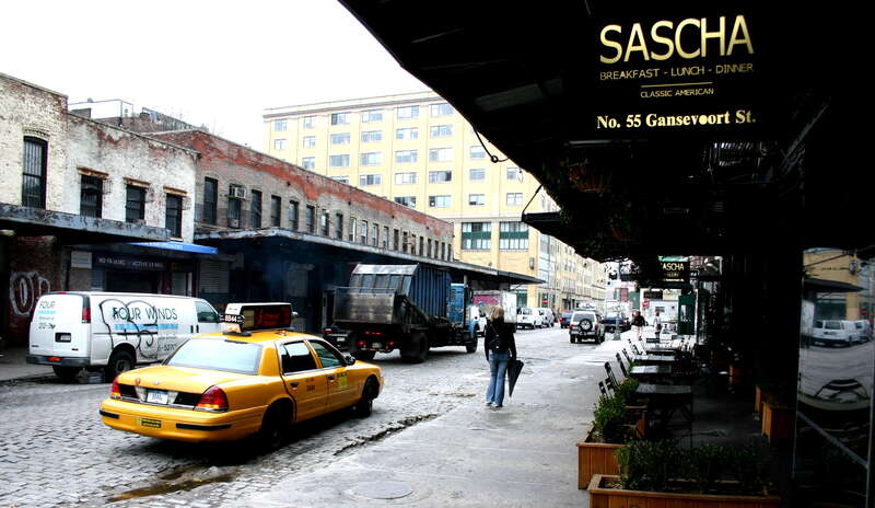 Looking west on Gansevoort Street (three blocks south of West 14th Street), towards West Washington Street, in the Meatpacking District of Manhattan, New York City.  At right, a restaurant called Sascha (55 Gansevoort Street).  At left, a set of
