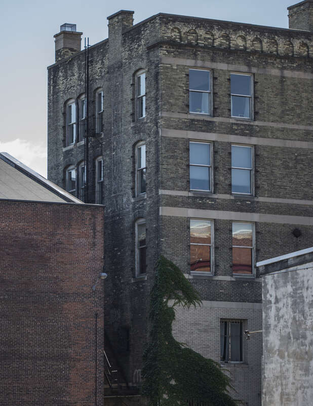 500px provided description: I like the interplay of shadow and highlihgt on architecture. [#telephoto ,#Canon 6D ,#Cityscape ,#Urban ,#Outdoors ,#Downtown ,#Alleyway]