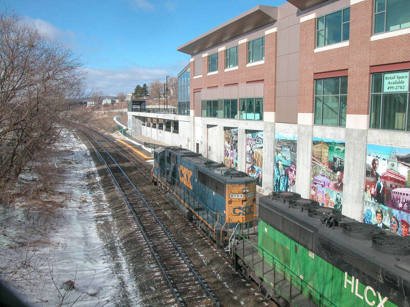 A CSX train passes Joseph Scelsi Intermodal Transportation Center in Pittsfield, Massachusetts