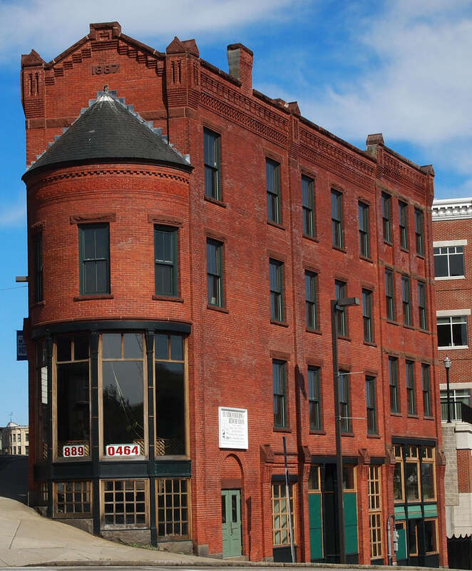Connecticut - New London County - Norwich
National Register of Historic Places #82001007 NRIS
2011 May 01 From Chelsea Harbor Dr. and West Main St; view E
edit: crop

White sign says &quot;Flatiron Building Restoration&quot;. Building is currently empty.