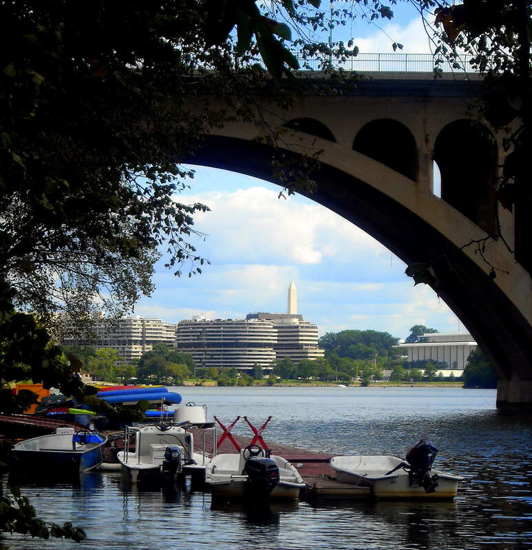 The Potomac River and Francis Scott Key Bridge in the Georgetown neighborhood of Washington, D.C. Looking east towards the Washington Monument, and the Foggy Bottom neighborhood including the Watergate Complex and JFK Center for the Performing Arts.