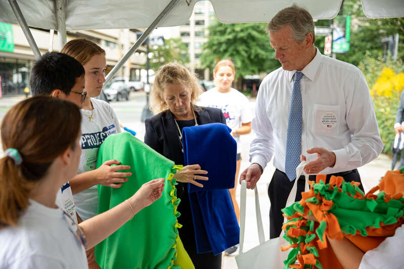 &quot;Governor Charlie Baker and First Lady Lauren Baker join state and local officials to make care packages for members of the military with the Massachusetts Military Heroes Fund and Project 351 in Boston on Sept. 11, 2022.&quot;